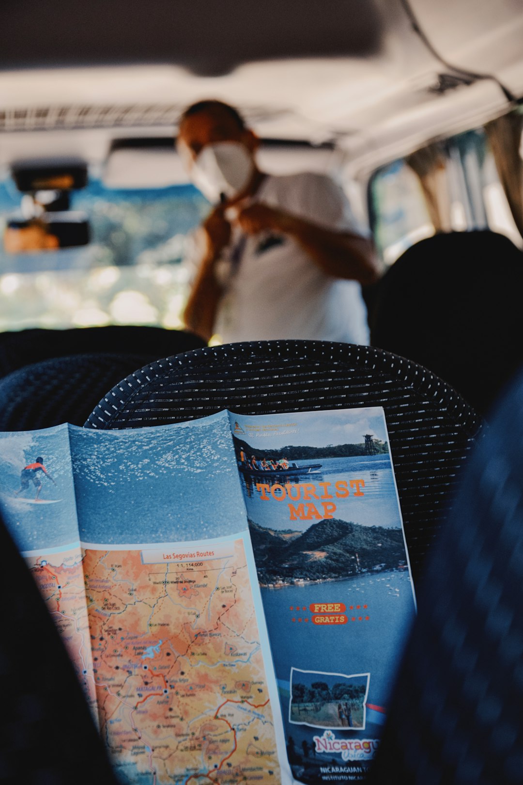 a-person-sitting-in-a-vehicle-with-a-map-ay9ybwfdmei
